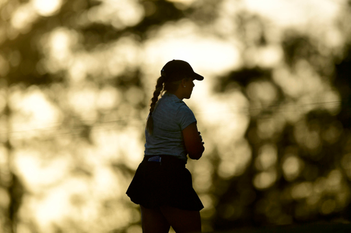 Jensen Castle of the United States is silhouetted by the setting sun on No. 14 during the second round of the Augusta National Women's Amateur at Champions Retreat Golf Club, Thursday, March 31, 2022.