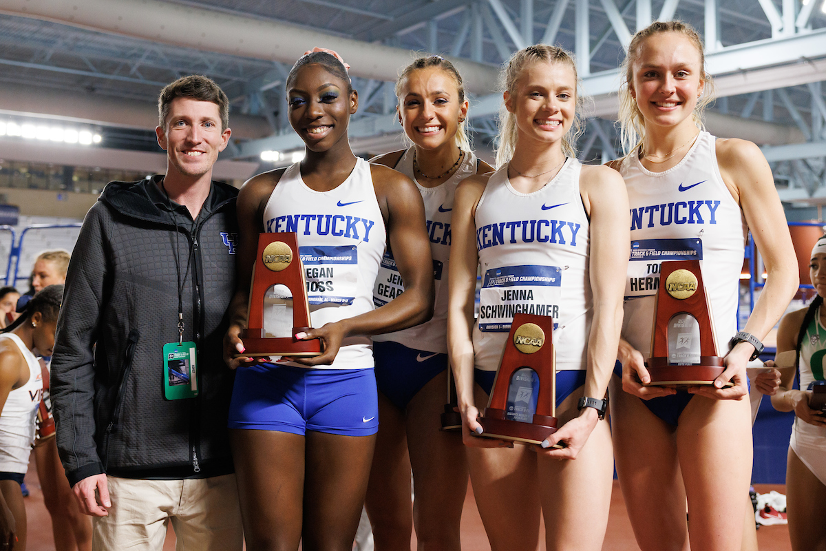 Megan Moss. Jenna Gearing. Jenna Schwinghamer. Tori Herman. Coach Hakon Devries.

Day 1 of NCAA Track and Field Championship.

Photo by Elliott Hess | UK Athletics