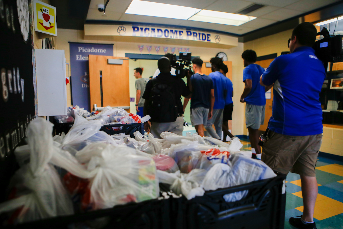 Men's Basketball team delivers food to God’s Pantry at Picadome Elementary. 

Photo by Hannah Phillips | UK Athletics