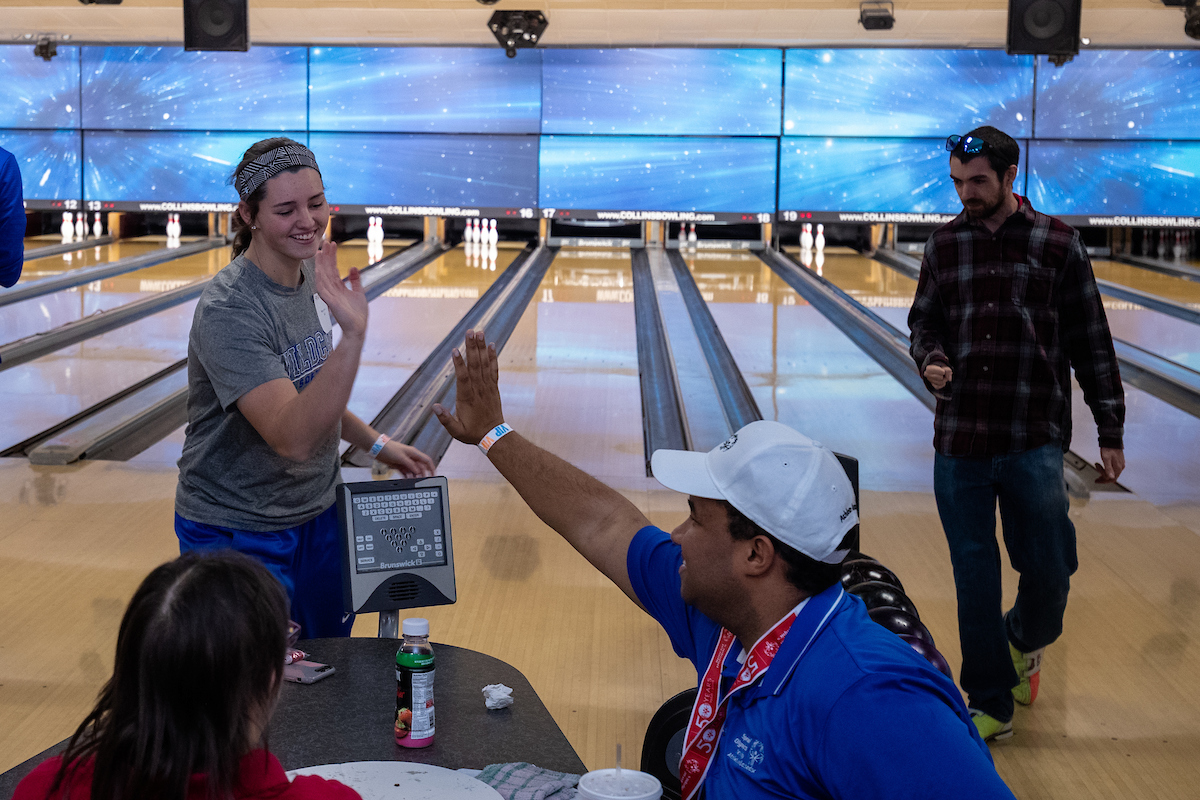 UK athletes bowl with members of Special Olympics at Collins Bowling Alley on , Saturday Dec. 8, 2018  in Lexington, Ky. Photo by Mark Mahan