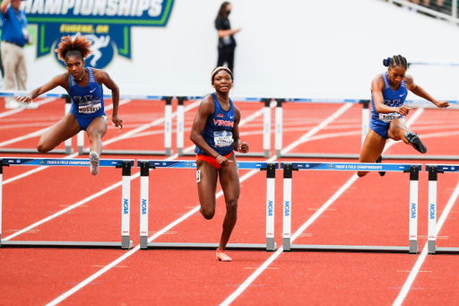 Masai Russell. Faith Ross.

Day 4. 2021 NCAA Track and Field Championships.

Photo by Chet White | UK Athletics