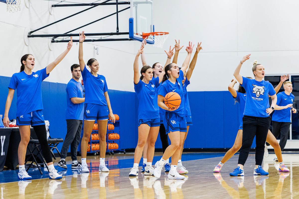 A picture of the Kentucky women's basketball team celebrating at practice