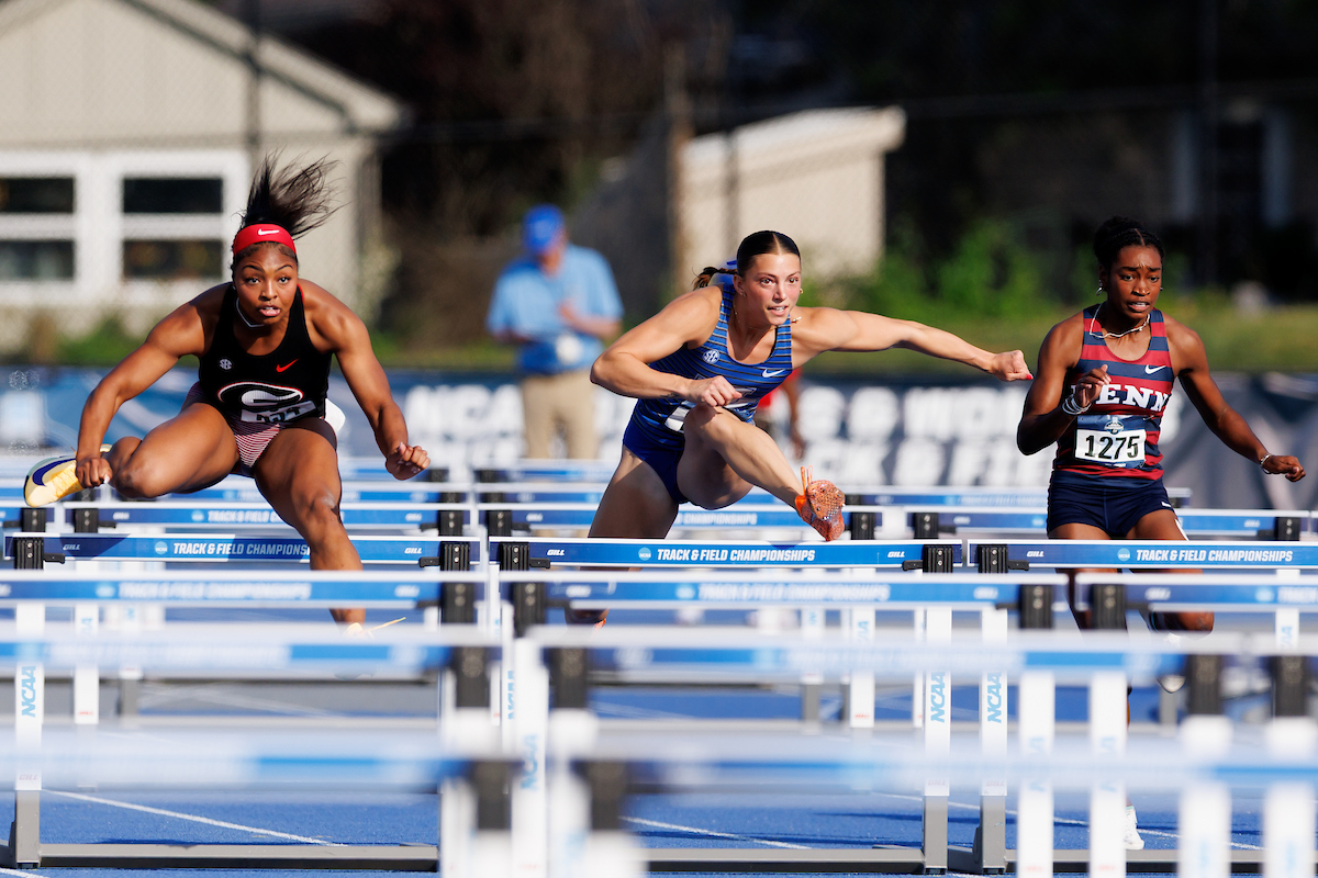 A picture of Camden Bentley leaping over a hurdle