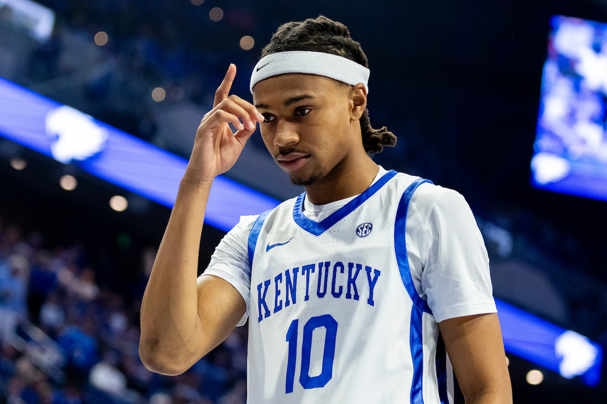 A picture of Alex Wilkins saluting the crowd after a basket