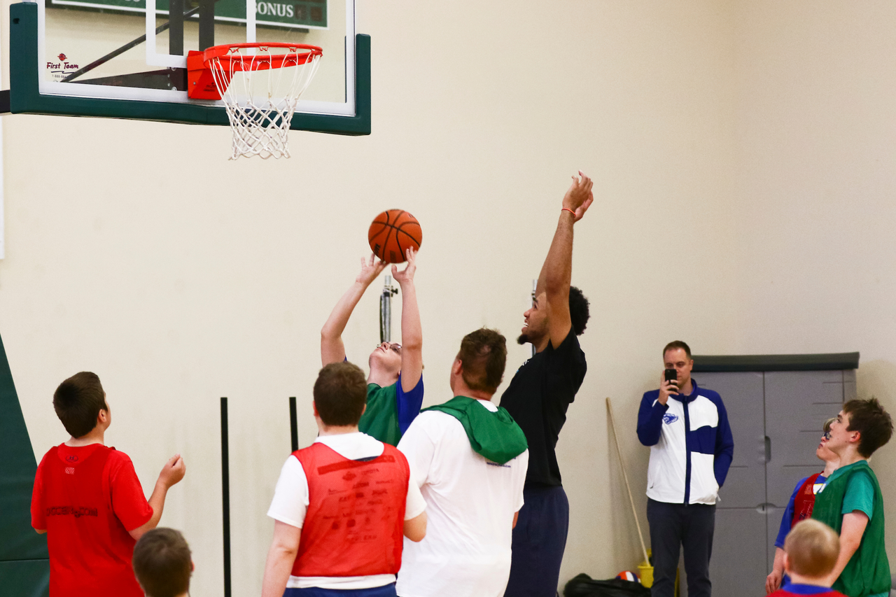 EJ Montgomery. Fans. 

EJ Montgomery and Immanuel Quickley play basketball with with kids during a camp at Winstar Farm on Thursday, June 20th. 

Photo by Eddie Justice | UK Athletics