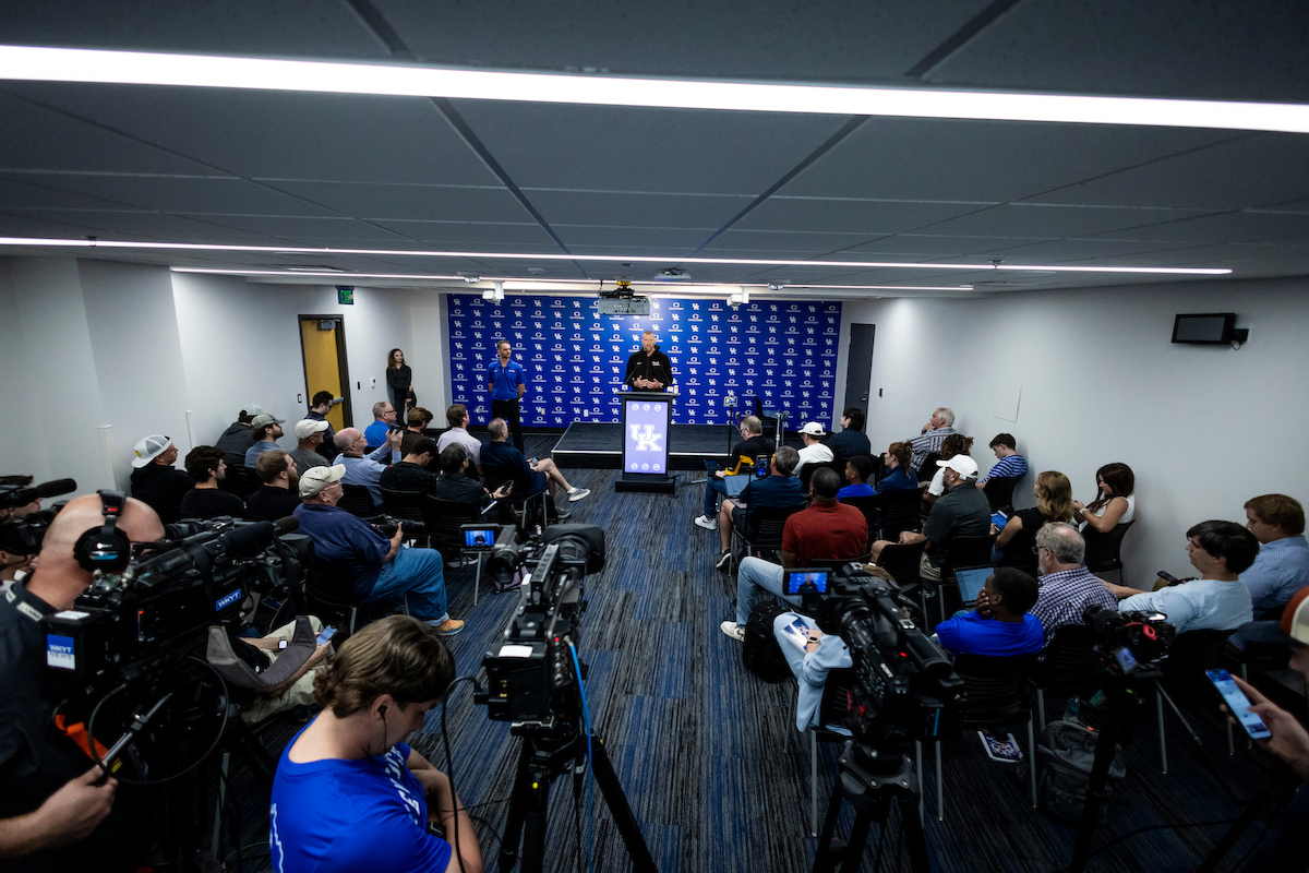 A picture of Mark Pope speaking to reporters at UK's Media Day