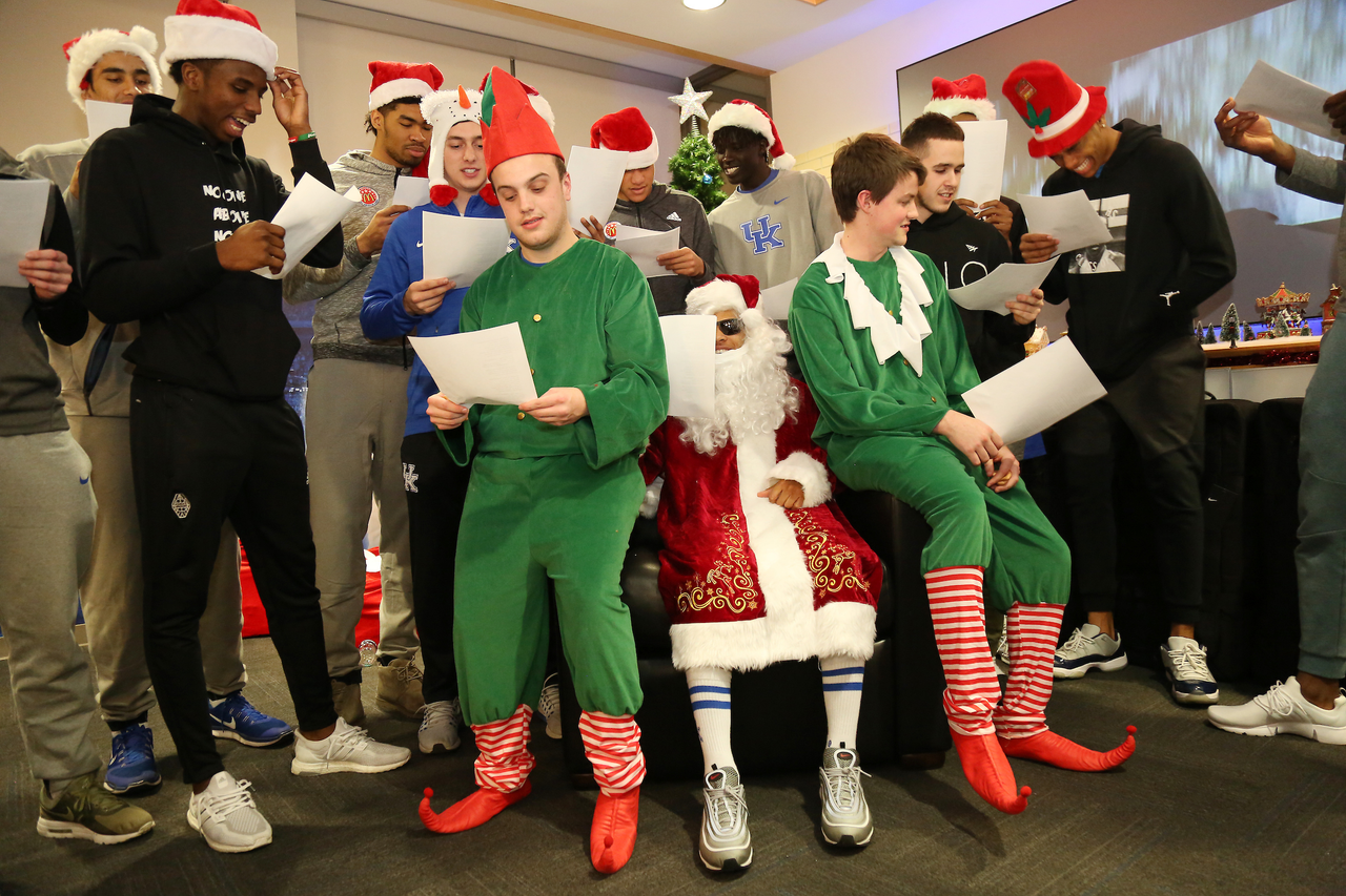 The Kentucky men's basketball team delivered an early Christmas to 10 families in Lexington. 