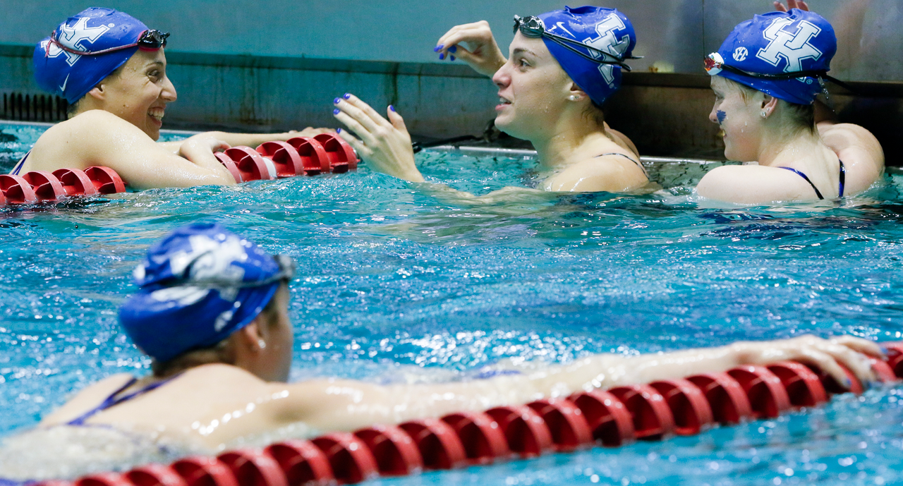 Kentucky swimmers laugh together in the practice pool during the final day of the 2019 SEC Swimming and Diving Championships in the Gabrielsen Natatorium at the University of Georgia in Athens, Ga., on Saturday, Feb. 23, 2019. (Casey Sykes)
