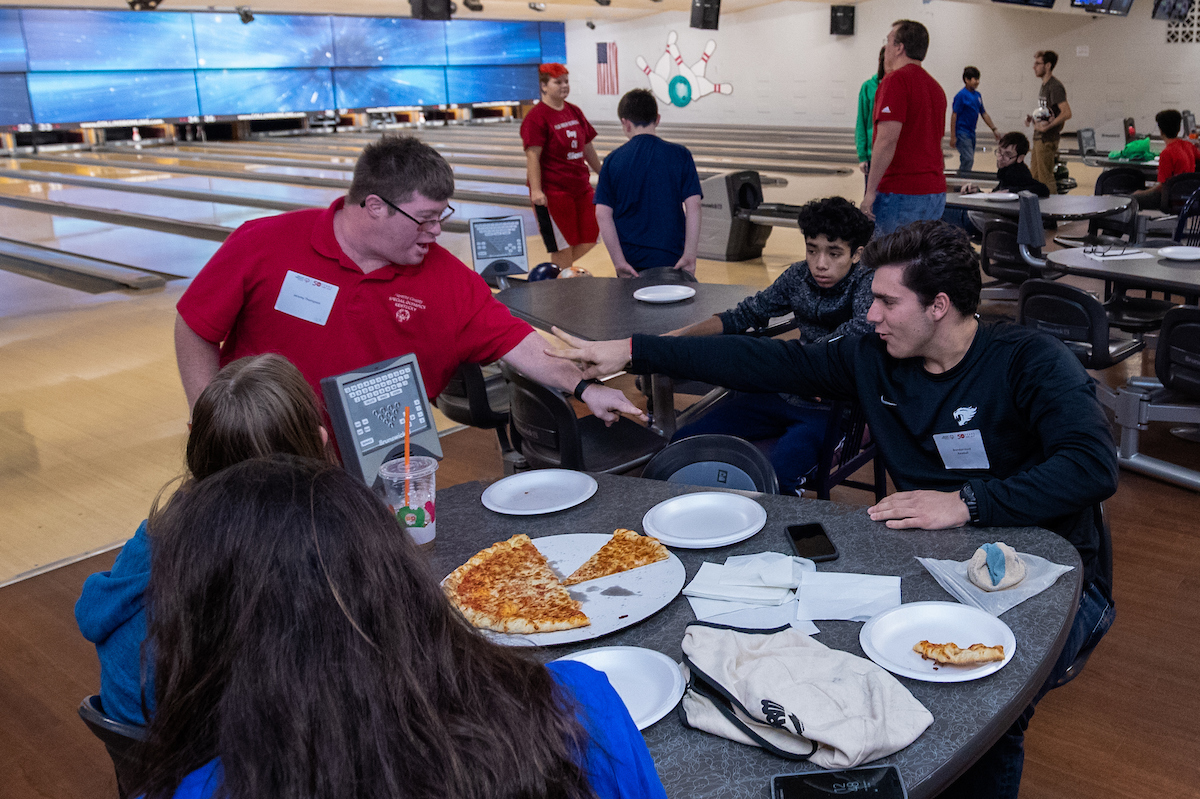 UK athletes bowl with members of Special Olympics at Collins Bowling Alley on , Saturday Dec. 8, 2018  in Lexington, Ky. Photo by Mark Mahan
