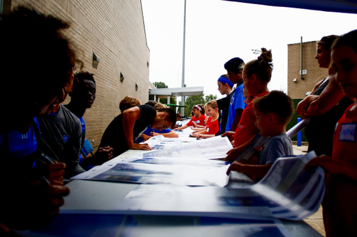 Autographs. 

Fans play with the Kentucky Men?s soccer team during fan day.

Photo by Eddie Justice | UK Athletics