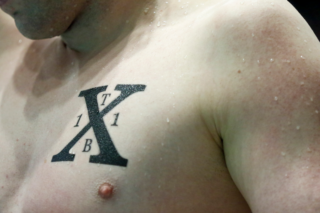 A Kentucky swimmer's tattoo is seen during the final day of the 2019 SEC Swimming and Diving Championships in the Gabrielsen Natatorium at the University of Georgia in Athens, Ga., on Saturday, Feb. 23, 2019. (Casey Sykes)