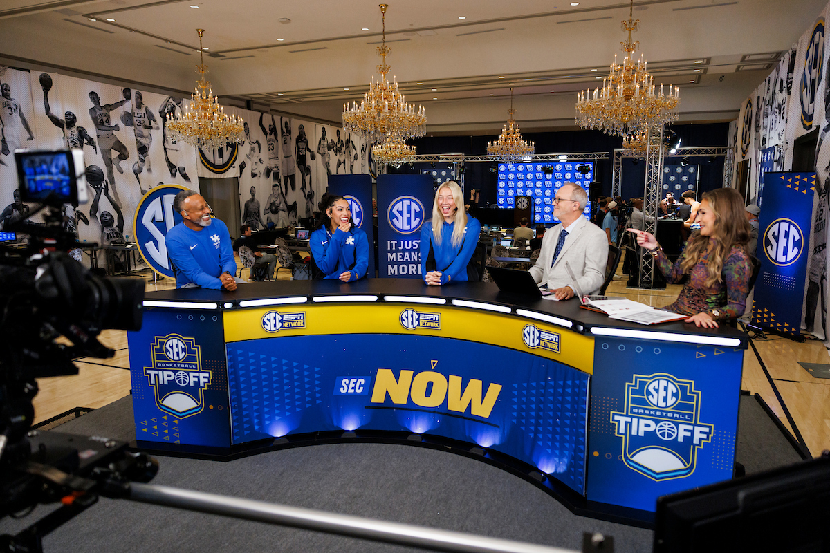 A picture of Kenny Brooks, Asia Boone and Clara Strack on the SEC Now set