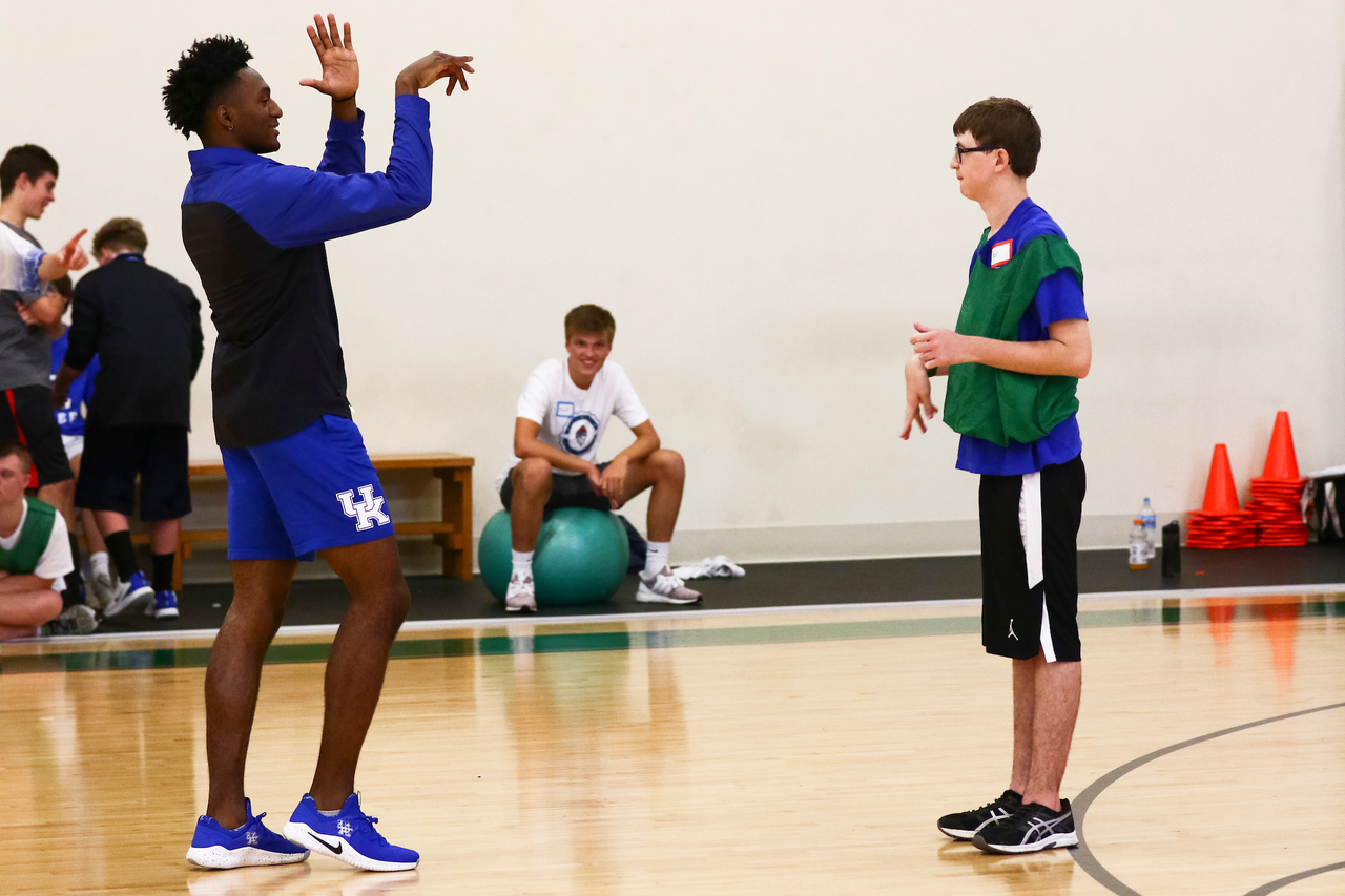 Immanuel Quickley. Fan. 

EJ Montgomery and Immanuel Quickley play basketball with with kids during a camp at Winstar Farm on Thursday, June 20th. 

Photo by Eddie Justice | UK Athletics