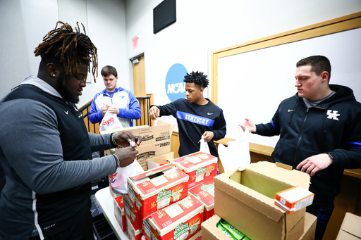 Octavious Oxendine. John Young. Andru Phillips. Tyler Malin.

Kentucky football players pack lunches for God’s Pantry Food Bank.

Photo by Elliott Hess | UK Athletics
