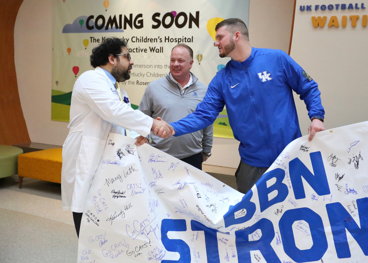 Mark Stoops and CJ Conrad.

Sarah Howard and her family are presented with a vacation trip to the 2019 VRBO Citrus Bowl to cheer on the Kentucky Wildcats.

Photo by Noah J. Richter | UK Athletics