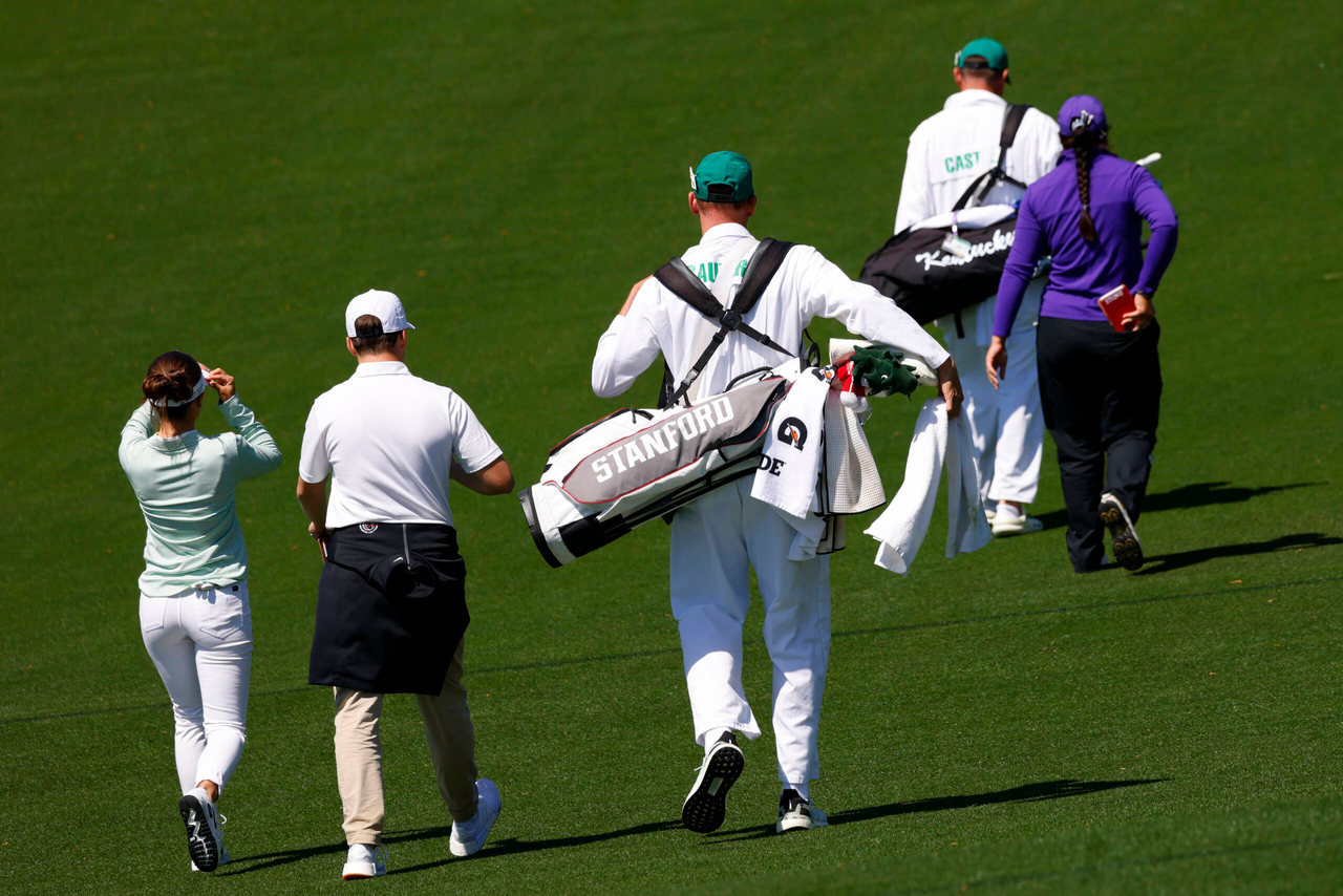 Aline Krauter of Germany, Latanna Stone of the United States and Jensen Castle of the United States walk up the No. 1 hole during a practice round for the Augusta National Women's Amateur at Augusta National Golf Club, Friday, April 1, 2022.