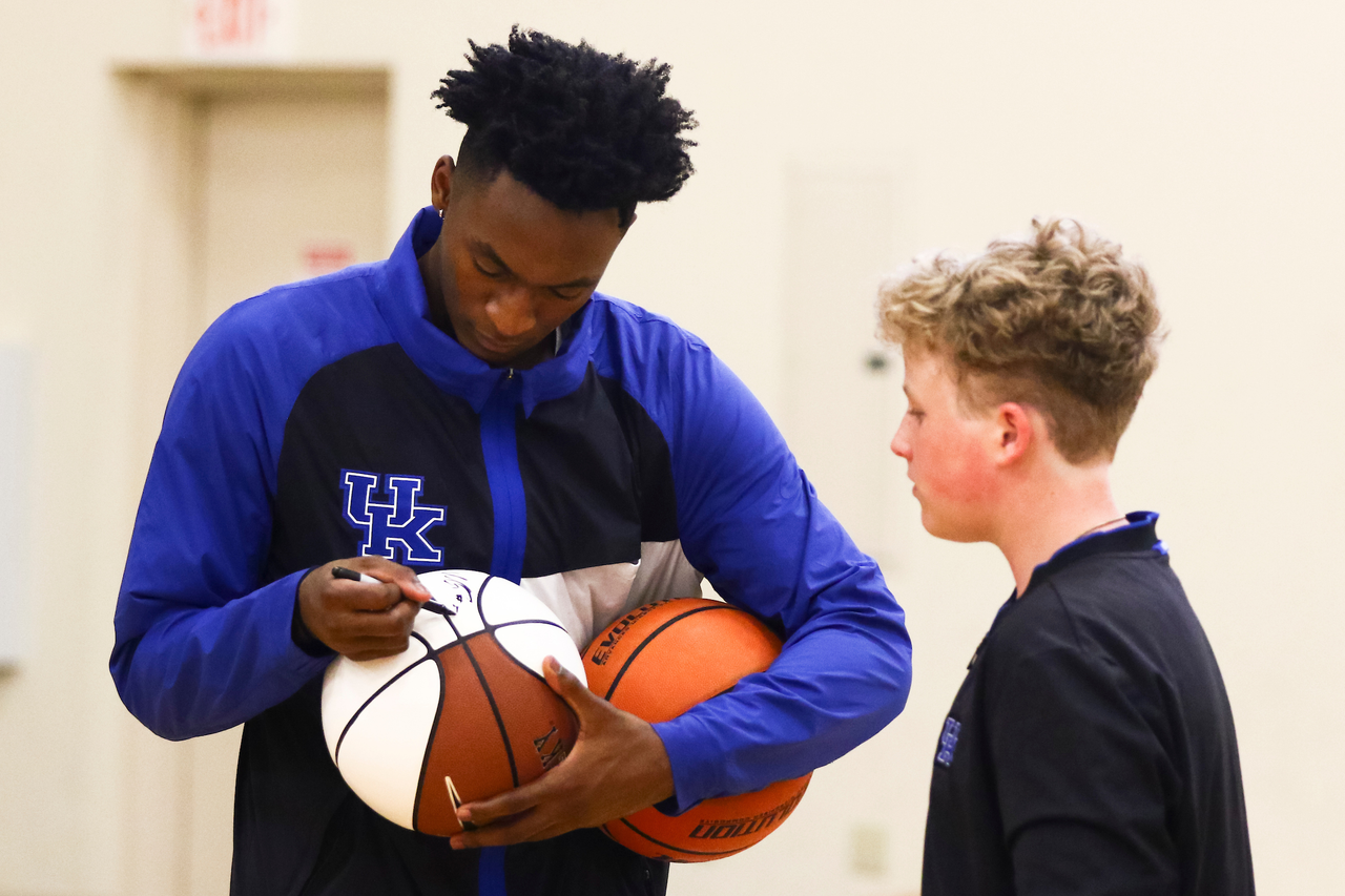 Immanuel Quickley. Autograph. 

EJ Montgomery and Immanuel Quickley play basketball with with kids during a camp at Winstar Farm on Thursday, June 20th. 

Photo by Eddie Justice | UK Athletics