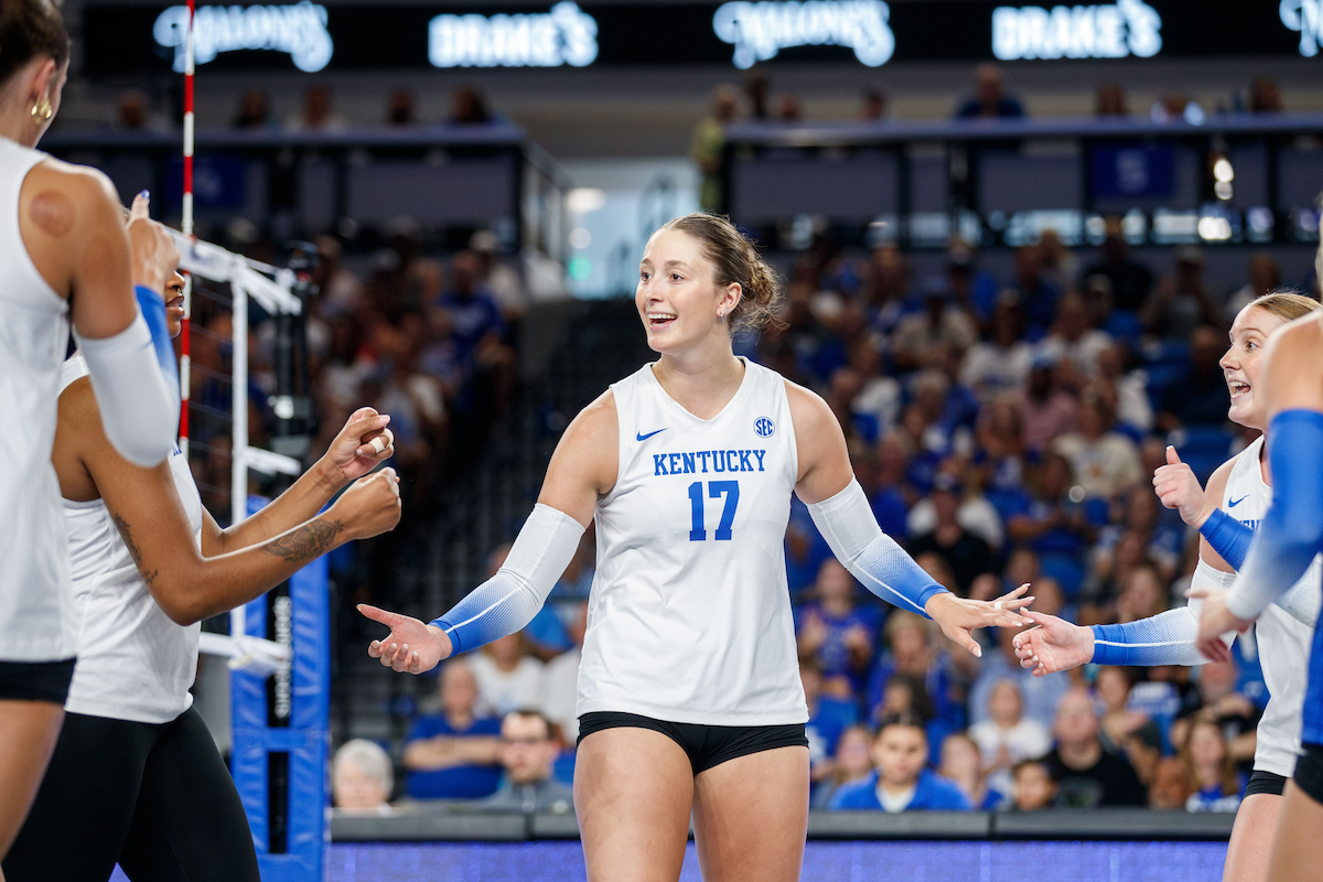 A picture of Brooklyn Deleye cheering on her team huddle