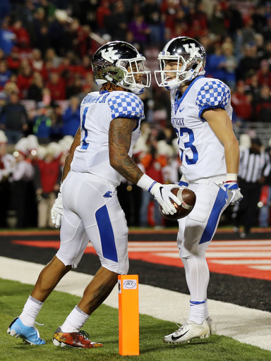 Lynn Bowden, David Bouvier

UK football beats Louisville 56-10 at Cardinal Stadium. 

Photo by Britney Howard  | UK Athletics