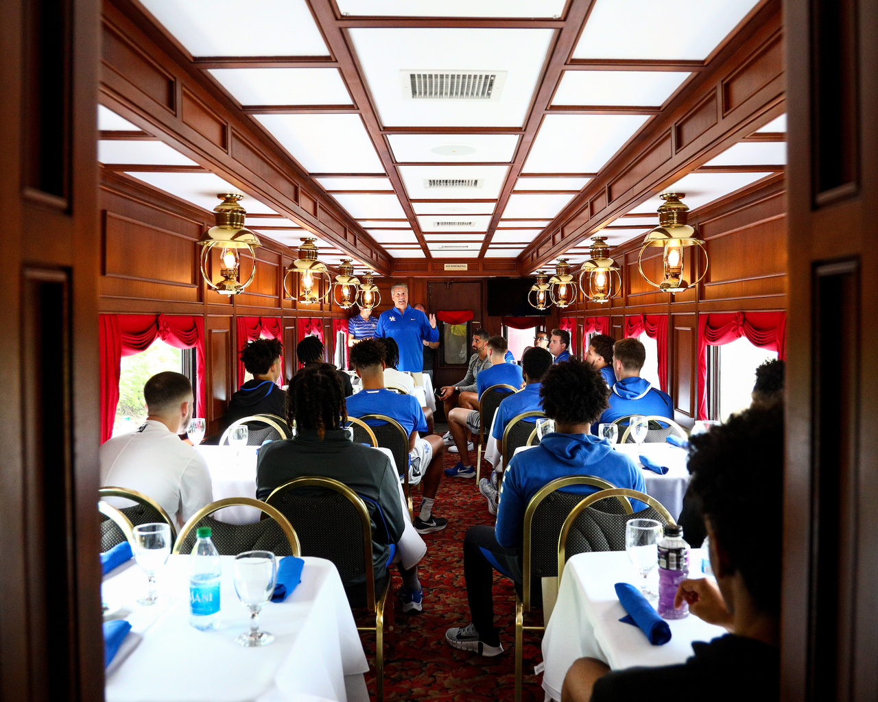 John Calipari. 

The Kentucky men's basketball team rode an RJ Corman train to the satellite camp at South Oldham High School in Crestwood, Kentucky.

Photo by Eddie Justice | UK Athletics
