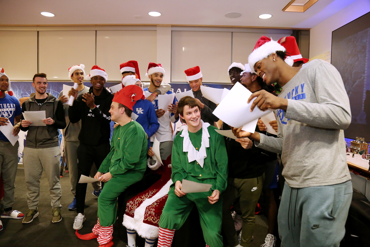 The Kentucky men's basketball team delivered an early Christmas to 10 families in Lexington. 