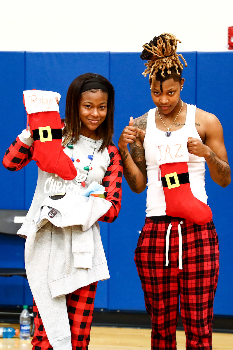 Robyn Benton. Jazmine Messengill. 

Kentucky WBB Christmas Party.

Photo by Eddie Justice | UK Athletics