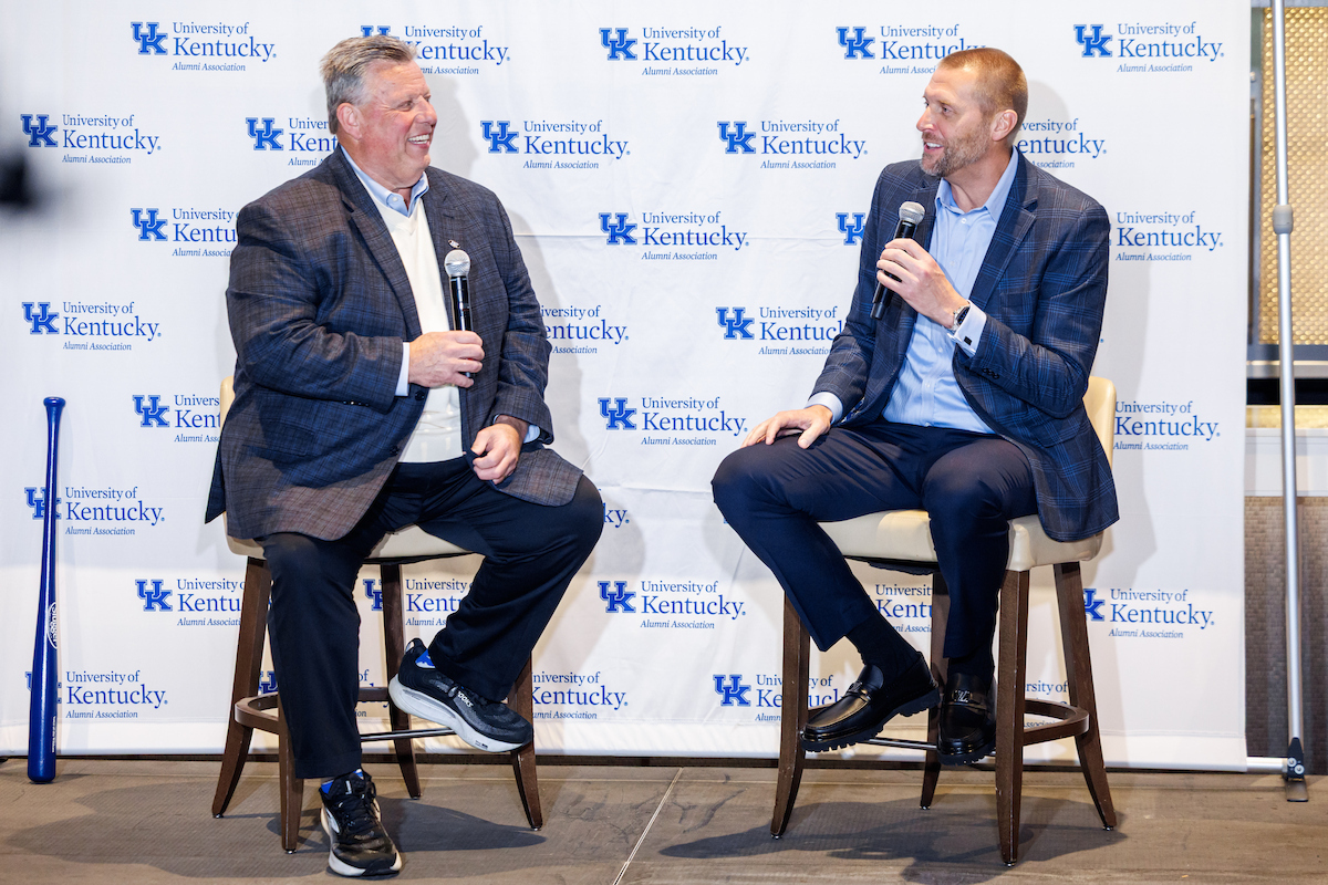 A picture of Tom Leach and Mark Pope seated and talking into microphones